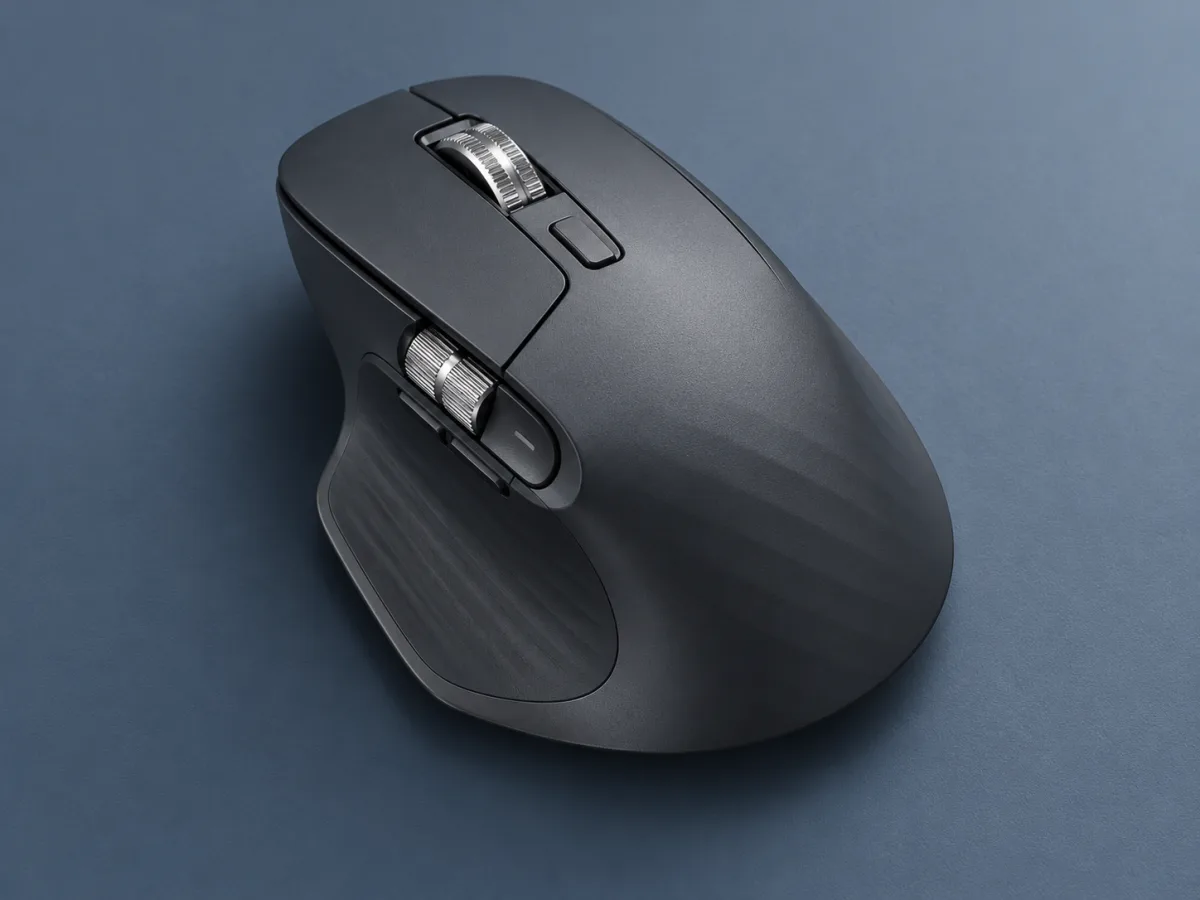 A sculpted wireless mouse photographed on a clean desktop